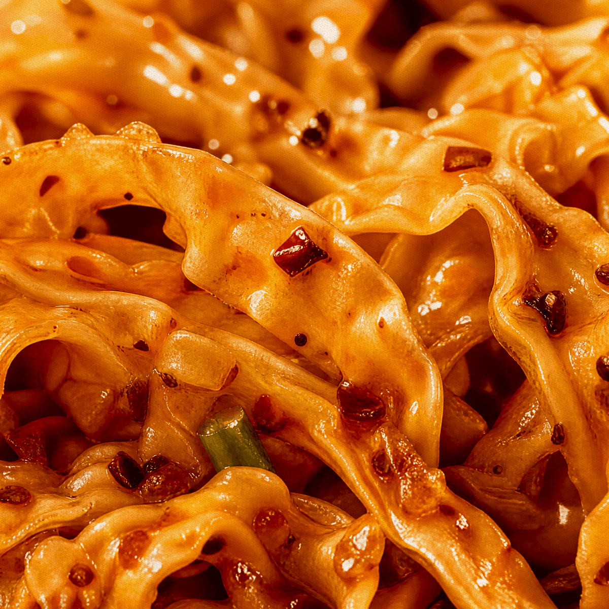 Close-up of Sichuan spicy noodles tossed with Fly By Jing chili crisp